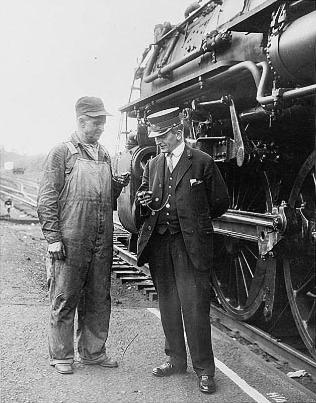 Conductor and Engineer Checking the Time.